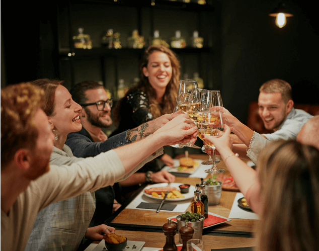 Friends enjoying a meal together with wine