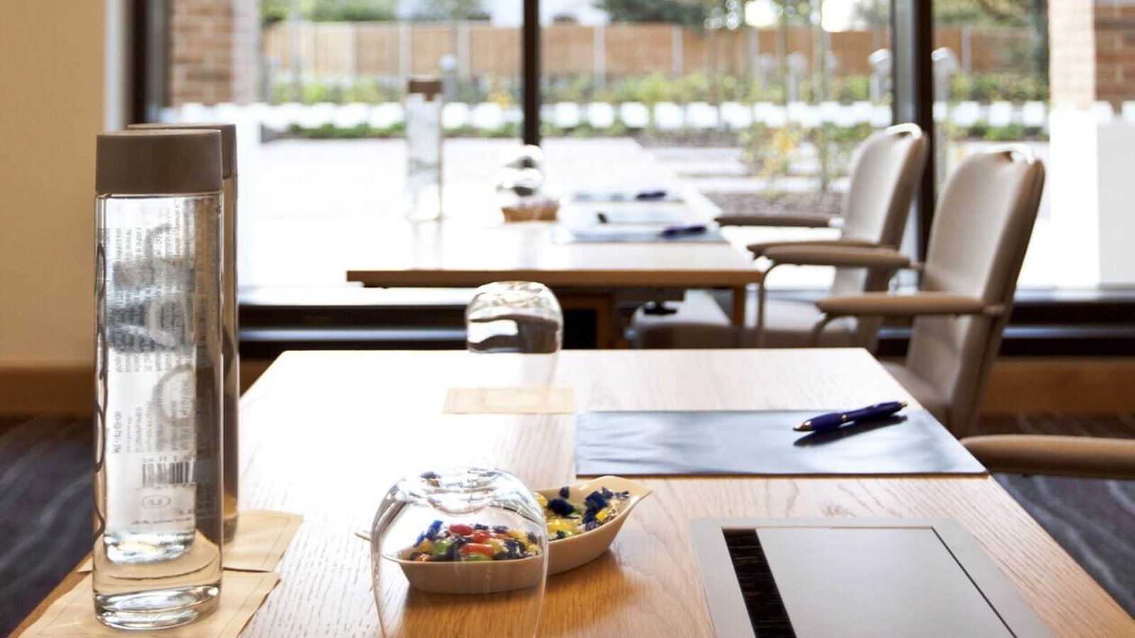Desks set up in preparation for a meeting