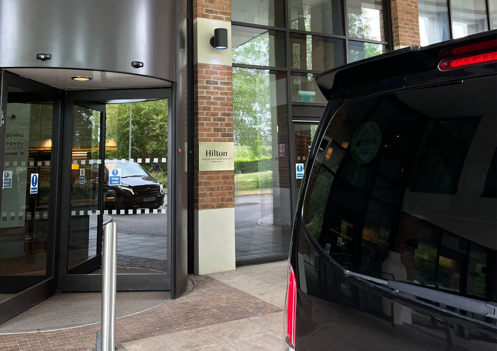Front entrance of Hilton London Heathrow Airport Terminal 5, ideal for guests arriving by private transfer.